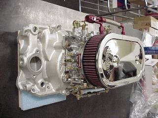 Carburetor And Intake Manifold On Work Bench