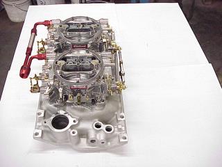 Carburetor And Intake Manifold On Work Bench