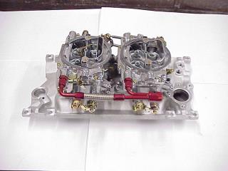 Carburetor And Intake Manifold On Work Bench