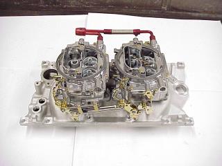 Carburetor And Intake Manifold On Work Bench